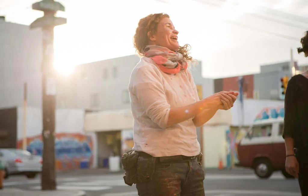 Woman smiling in a city street