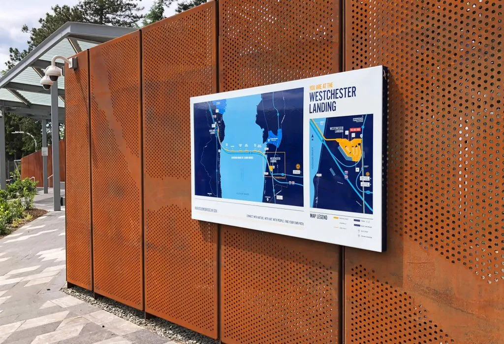 interpretive panel featuring a map hung on perforated steel wall