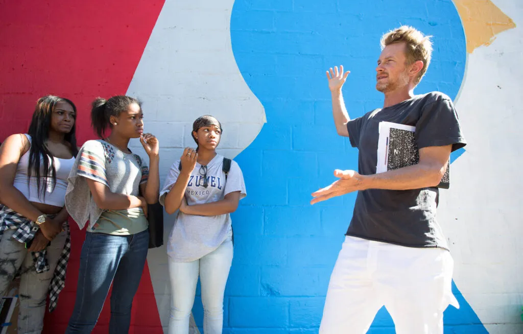 Artists discussing a mural in Philadelphia