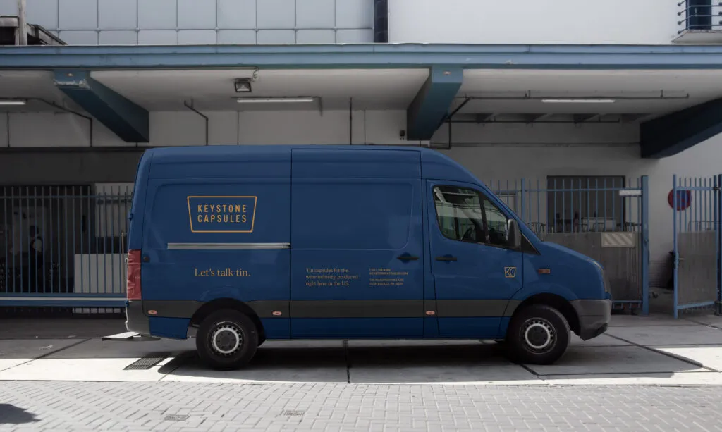 blue delivery truck with logo for wine company