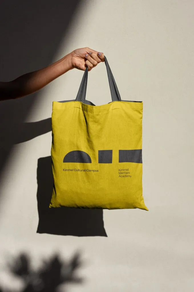 Yellow tote bag with graphic logo and branding by J2 for Kimmel Cultural Campus