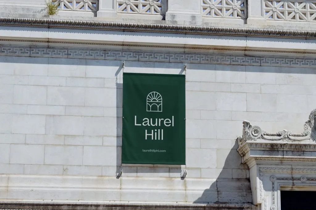 exterior signage with mono weight logo type on stone building