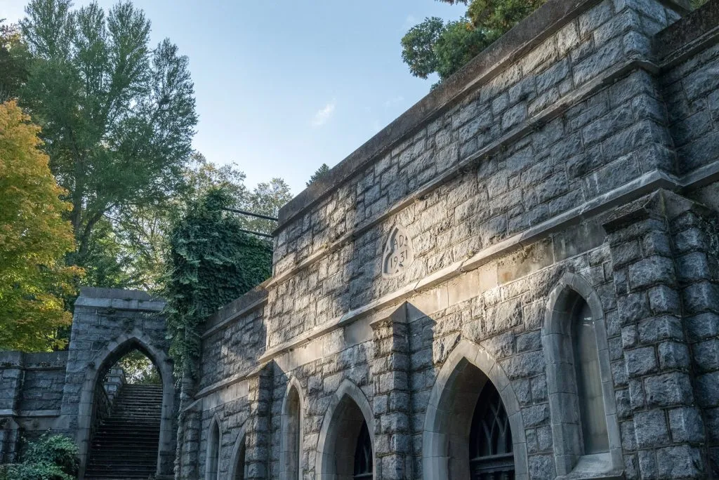 old stone exterior with archways in park