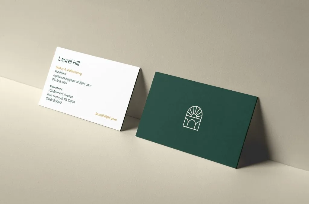 white and green business cards with mono-weight logo for Laurel Hill Cemetery and Arboretum logo by J2