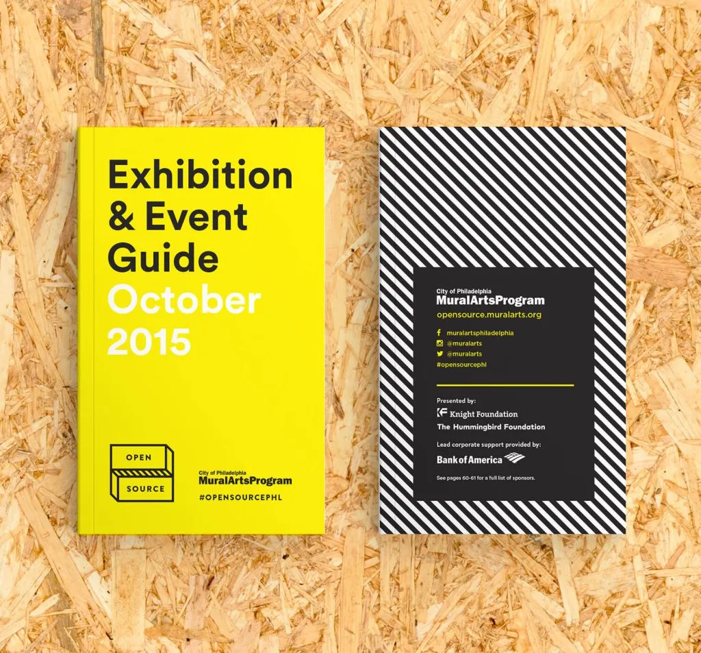 yellow exhibition guide book for city-wide arts festival for Mural Arts Program by J2