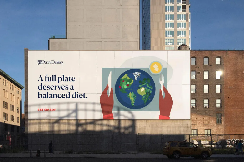 Illustrated brand campaign on building for university dining program featuring student eating healthy meal