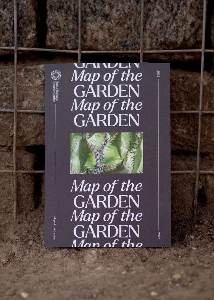 Cover of botanical garden map with full bleed typography and botanical photography, design by J2