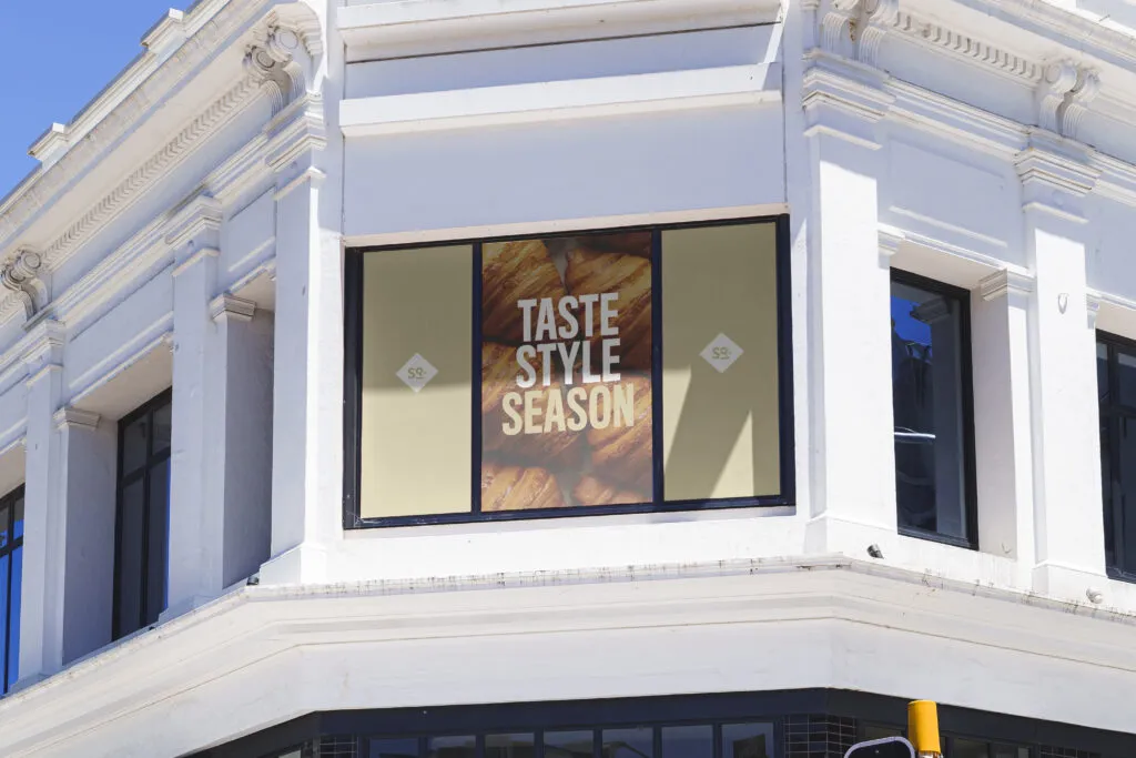 overhead window graphics with clean logos and bold san serif campaign messaging