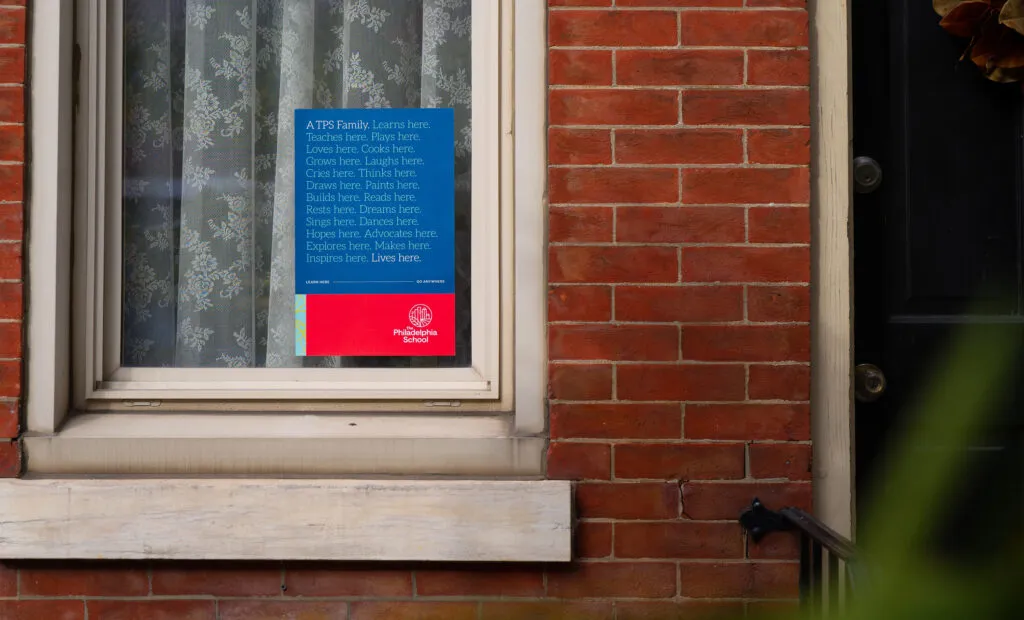 Identification signs on the front window of a brick building, signage and branding for The Philadelphia School by J2