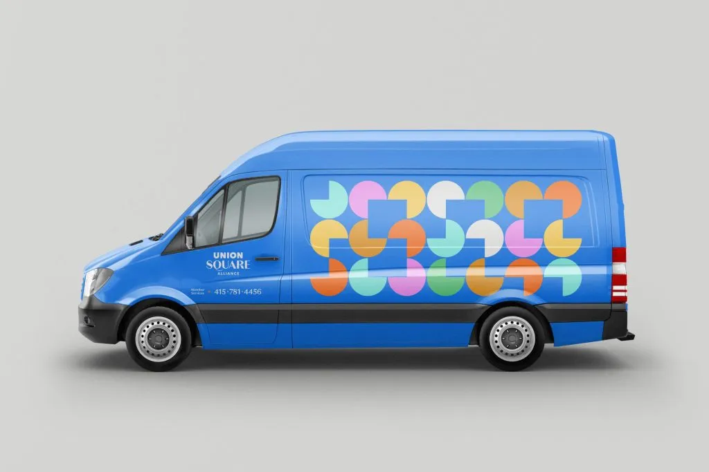 Transit van painted blue and branded with Union Square circles and squares graphics by J2