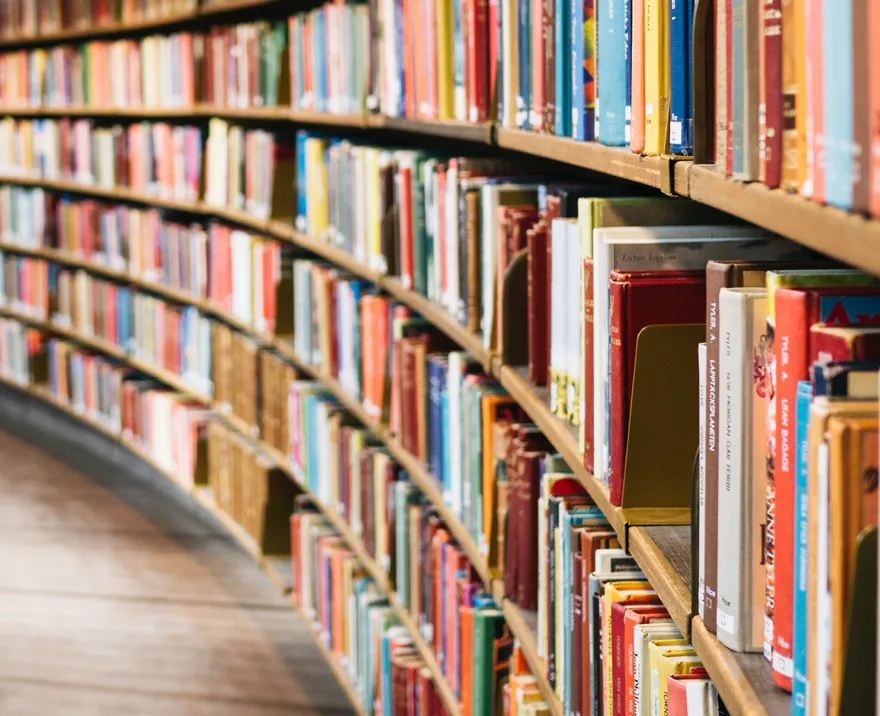 books on a curved library shelf