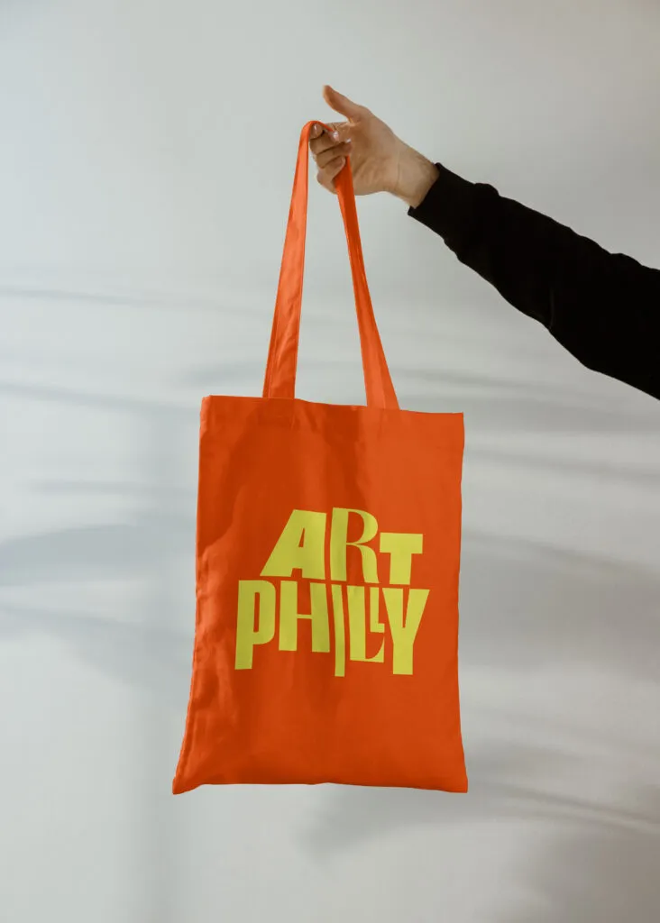 Graphic tote bag with arts festival logo, designed by J2 for ArtPhilly.