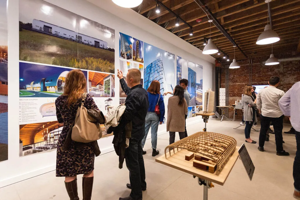 visitors exploring the BuildingStories exhibit at Huddle