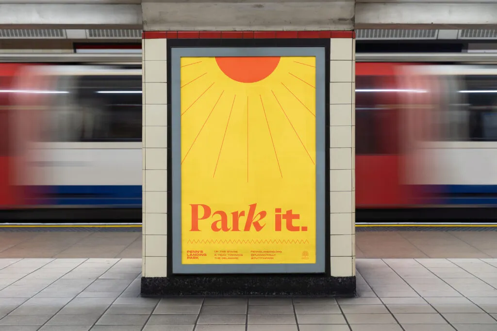 Subway advertisement with bold type and sun icon on a yellow background. Marketing material for Penn's Landing Park by J2.