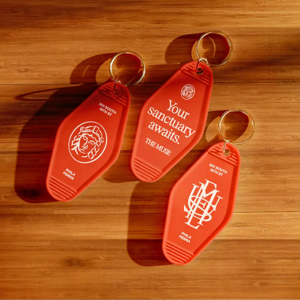 branded keychains for The Muse luxury apartments, design by J2