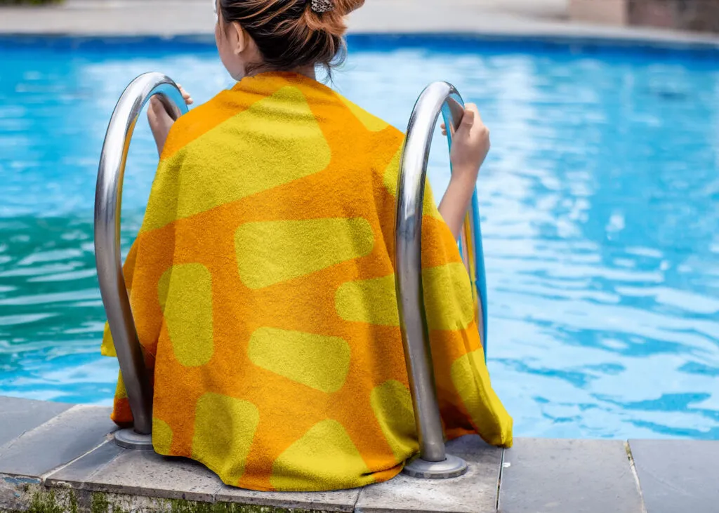 PlayaRaya yellow pattern towel design J2, child swimming at pool