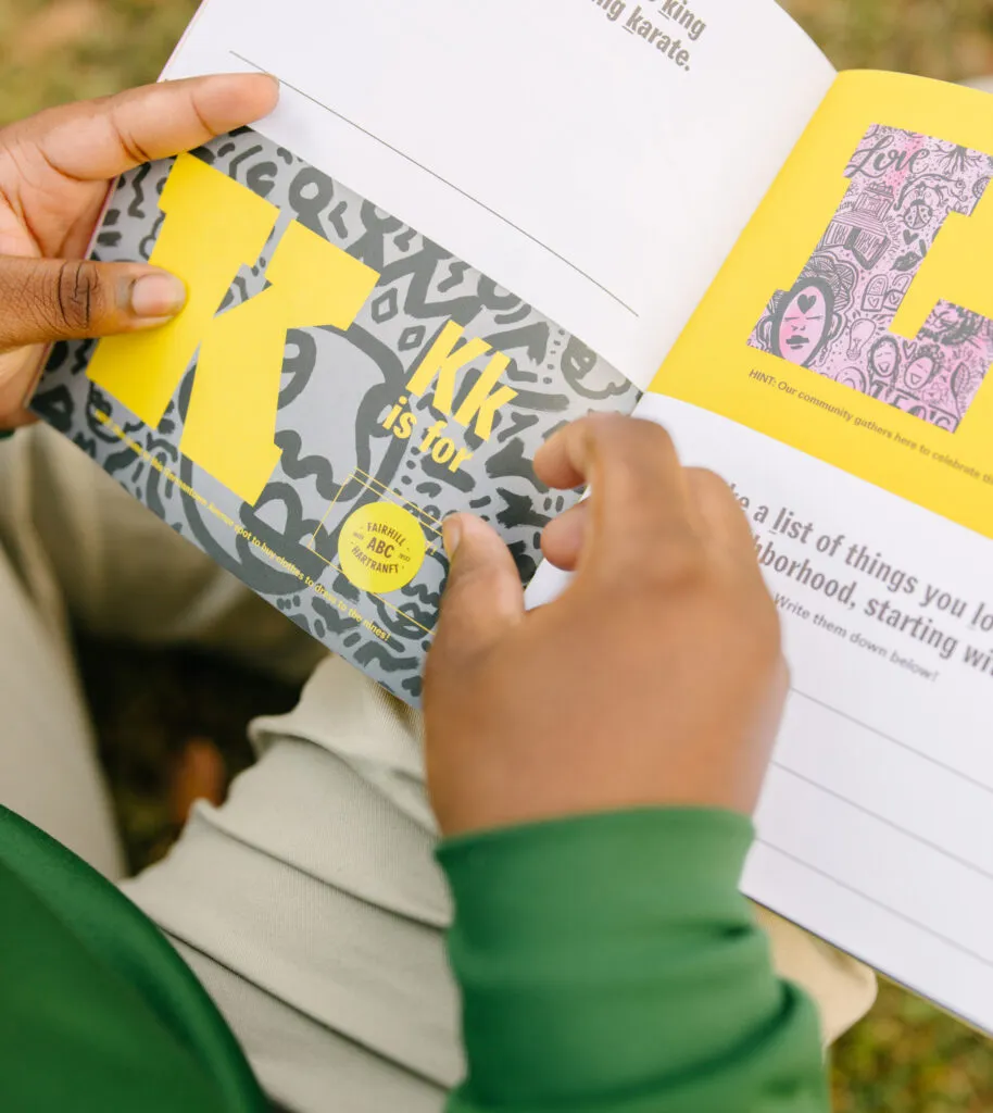 Teen boy interacting with brand look book stickers. Literacy Rich Initiative brand by J2.