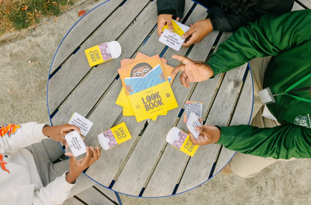 Boy playing with literacy cards. Literacy Rich Initiative brand by J2.