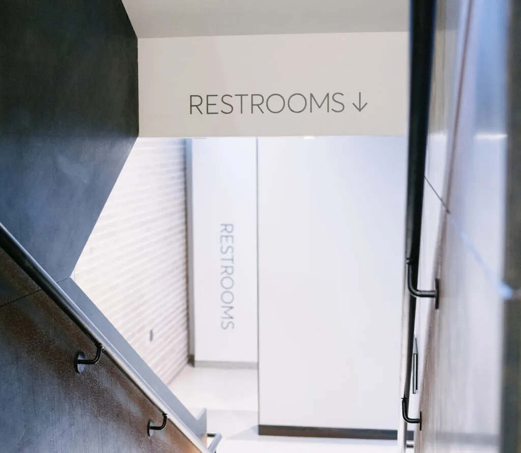 Restroom wall directionals